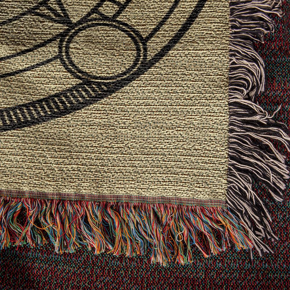 Corner laid flat of Heirloom Woven Blanket - Close-up view of fringed edges - Arcane Alchemy